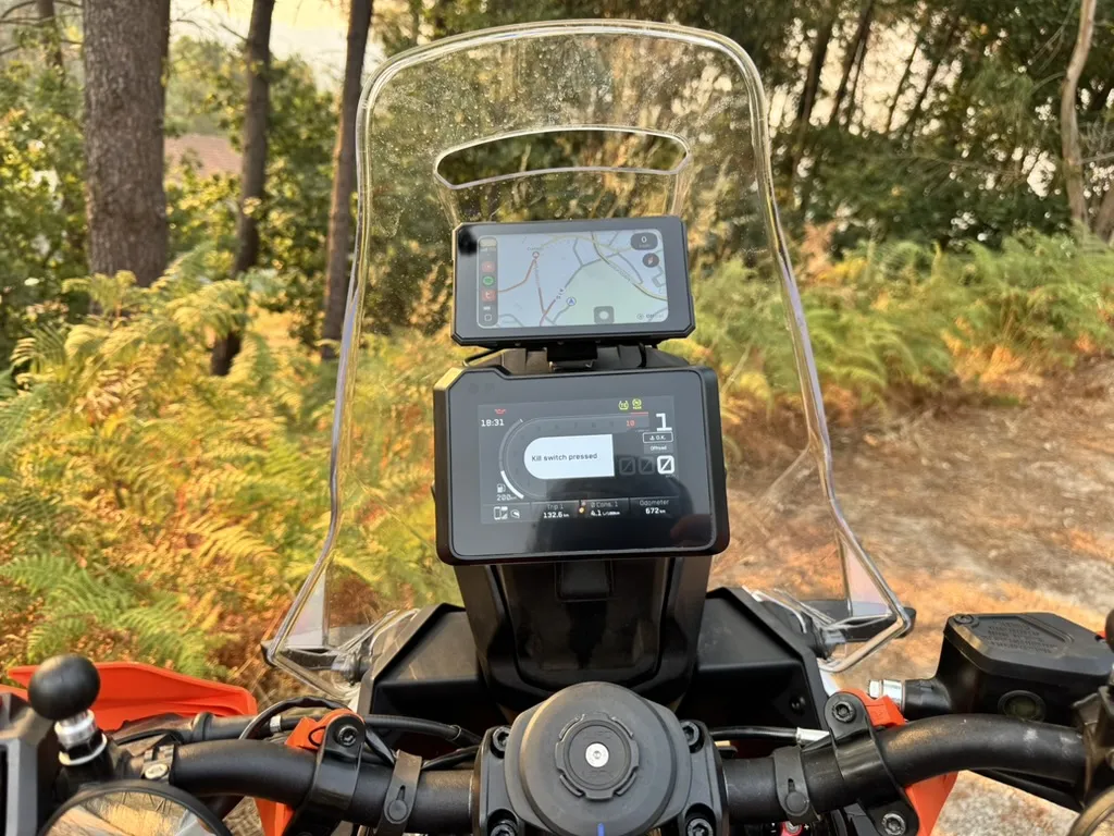 EKIY 5-inch display installed above the original instrument cluster of an adventure motorcycle