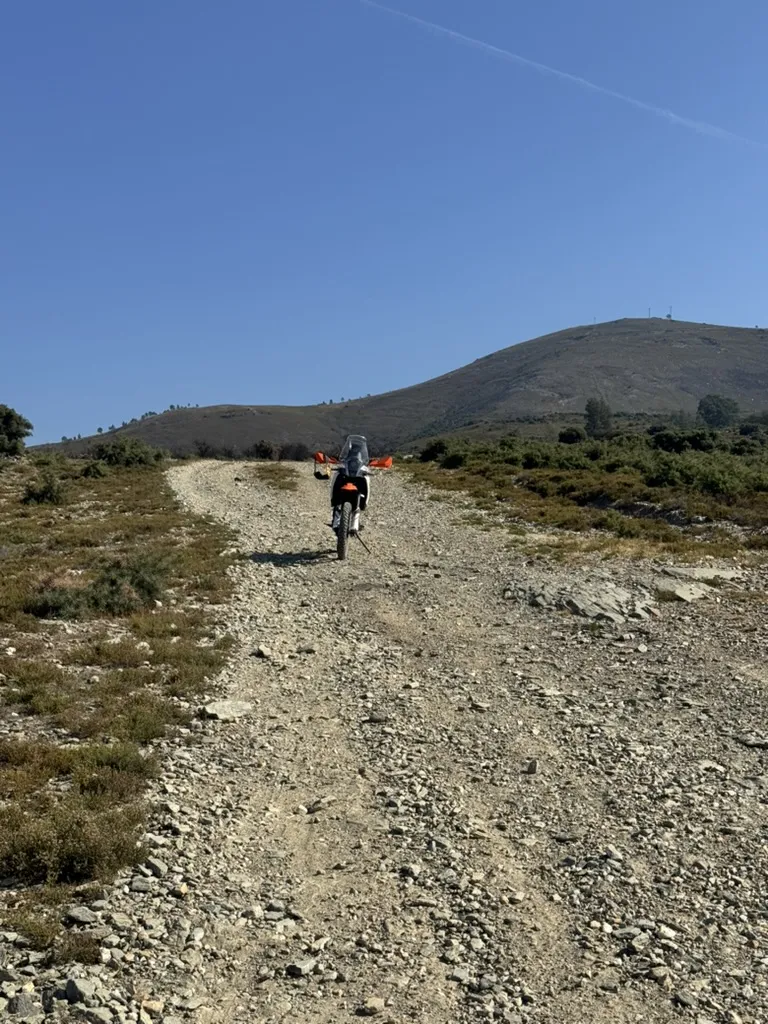 Adventure motorcycle on a rocky off-road track during the EKIY display field test