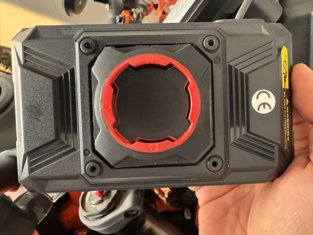 Quad Lock Universal Adaptor mounted to rear of EKIY motorcycle display