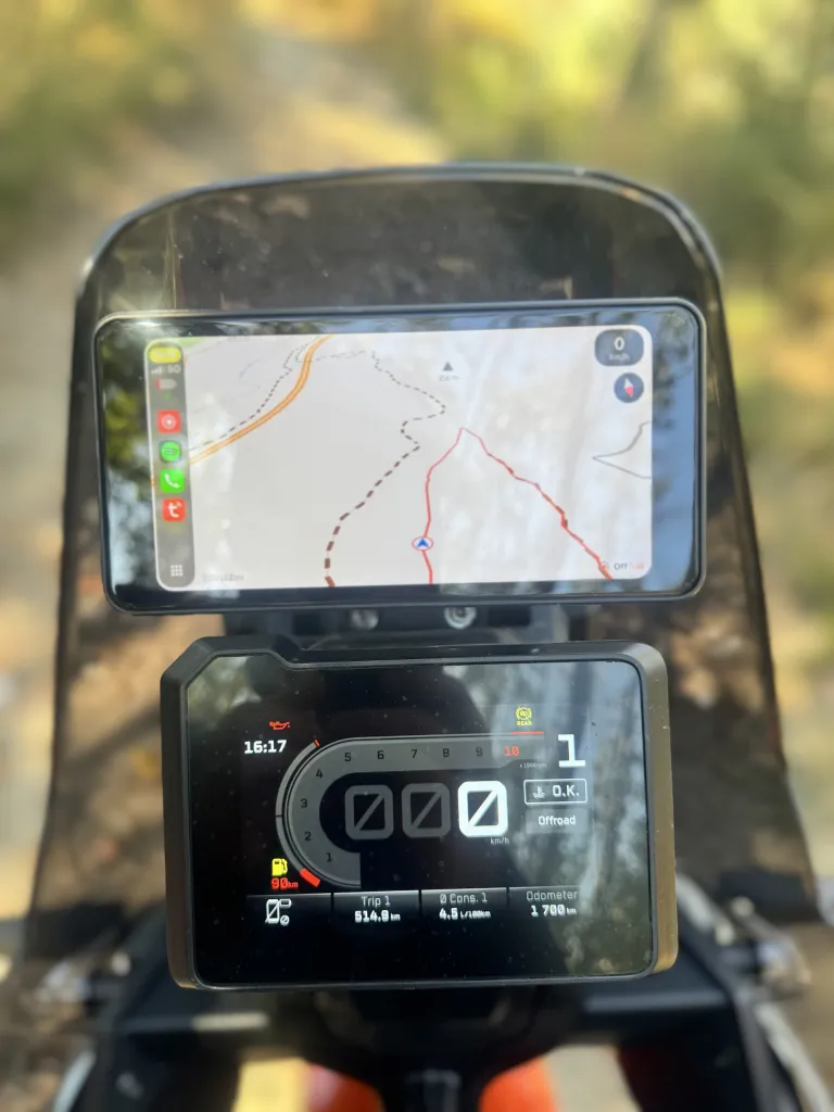 OffTrail GPX navigation running through CarPlay on the grandnavi M630 Pro display, above the motorcycle instrument cluster